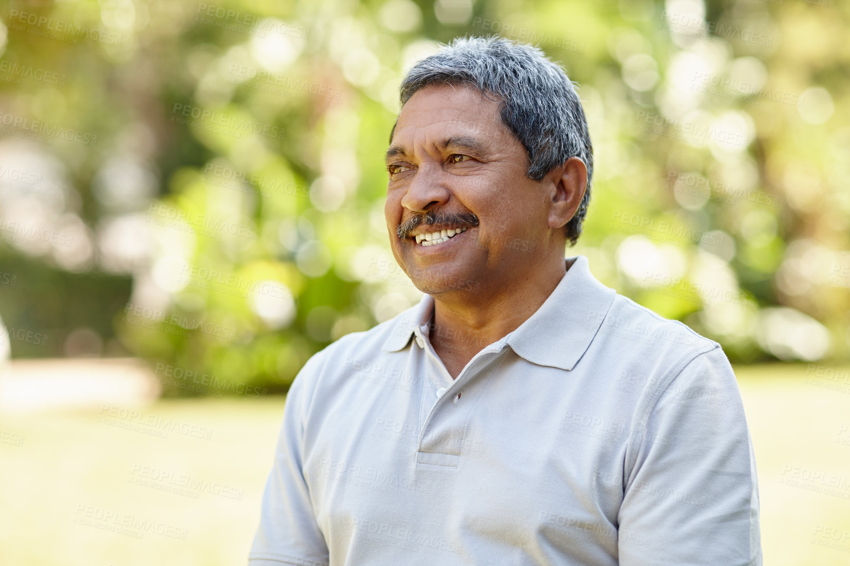 Buy stock photo Shot of a happy senior man enjoying a day outdoors