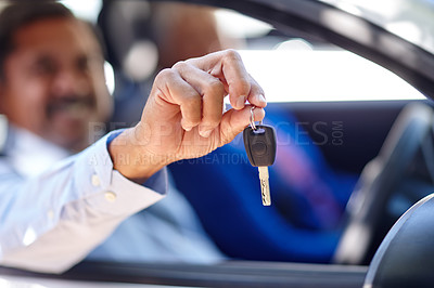 Buy stock photo Shot of a senior man sitting in a car with his wife and showing you his keys