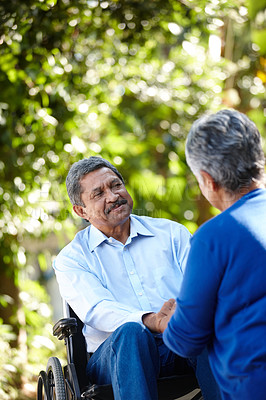 Buy stock photo Cropped shot of a senior couple talking outdoors