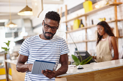 Buy stock photo Portrait of a bistro owner using a digital tablet