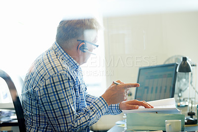 Buy stock photo Man, virtual assistant and headset for telecom in office for consultation, advice or customer care. Senior person, call centre and agent with discussion, talk or communication for help with help desk