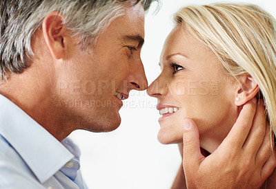 Buy stock photo Shot of a mature couple sharing a tender moment together at home