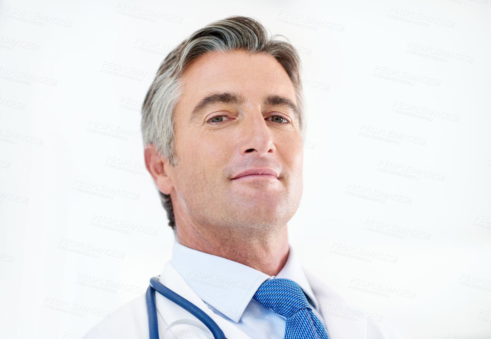 Buy stock photo Hospital, doctor and portrait of man on a white background for medical service, career and consulting. Professional, healthcare and person with stethoscope for cardiology, medicine and wellness