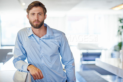 Buy stock photo Cropped portrait of a handsome young businessman in the office