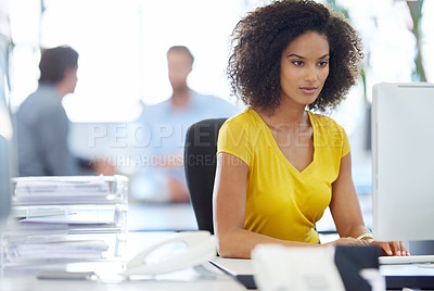 Buy stock photo Cropped shot of an attractive young businesswoman working at her office desk
