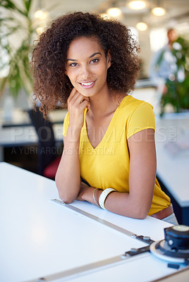 Buy stock photo Cropped portrait of a young female designer sitting at her office desk