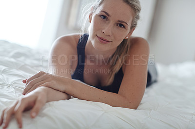 Buy stock photo Shot of an attractive young woman relaxing at home