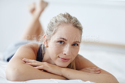 Buy stock photo Shot of an attractive young woman relaxing at home