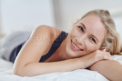 Buy stock photo Shot of an attractive young woman relaxing at home