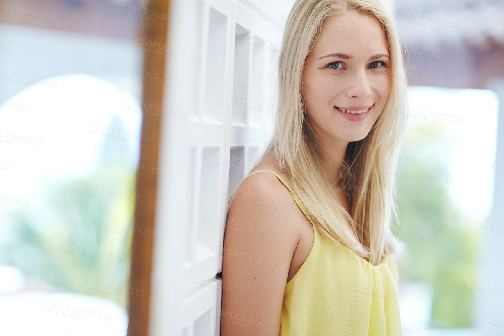 Buy stock photo Portrait of a beautiful young woman standing in a hallway at home