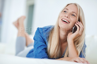 Buy stock photo Shot of an attractive young woman relaxing at home