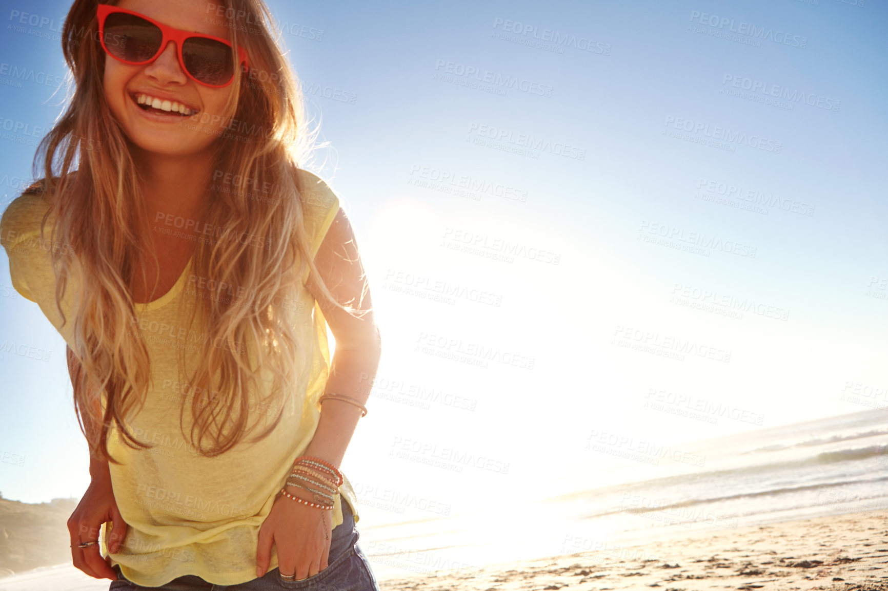 Buy stock photo Cropped shot of an attractive young woman on the beach