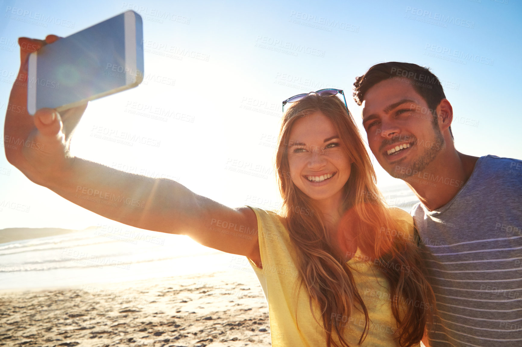 Buy stock photo Selfie, bonding and couple on beach for vacation, adventure or holiday with memory together. Smile, happy and man with woman for photography picture by ocean for summer weekend trip with travel.