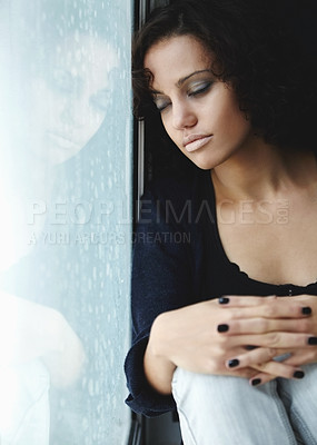 Buy stock photo Sad, rain and crying with woman by window for depression, tired and lonely. Anxiety, mental health and exhausted with female thinking at home for broken heart, disappointed and fear mockup