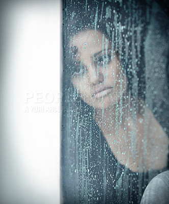 Buy stock photo Sad, rain and thinking with woman by window for depression, tired and lonely. Anxiety, mental health and exhausted with female contemplating at home for broken heart, disappointed and fear mockup