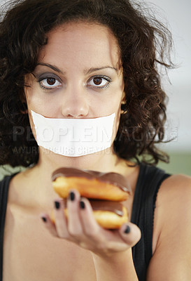 Buy stock photo Portrait, anorexia and woman with donut and tape over mouth to stop eating, unhappy and delusional. Face, covering and face of female suffering eating disorder, body dysmorphia or bulimia problem