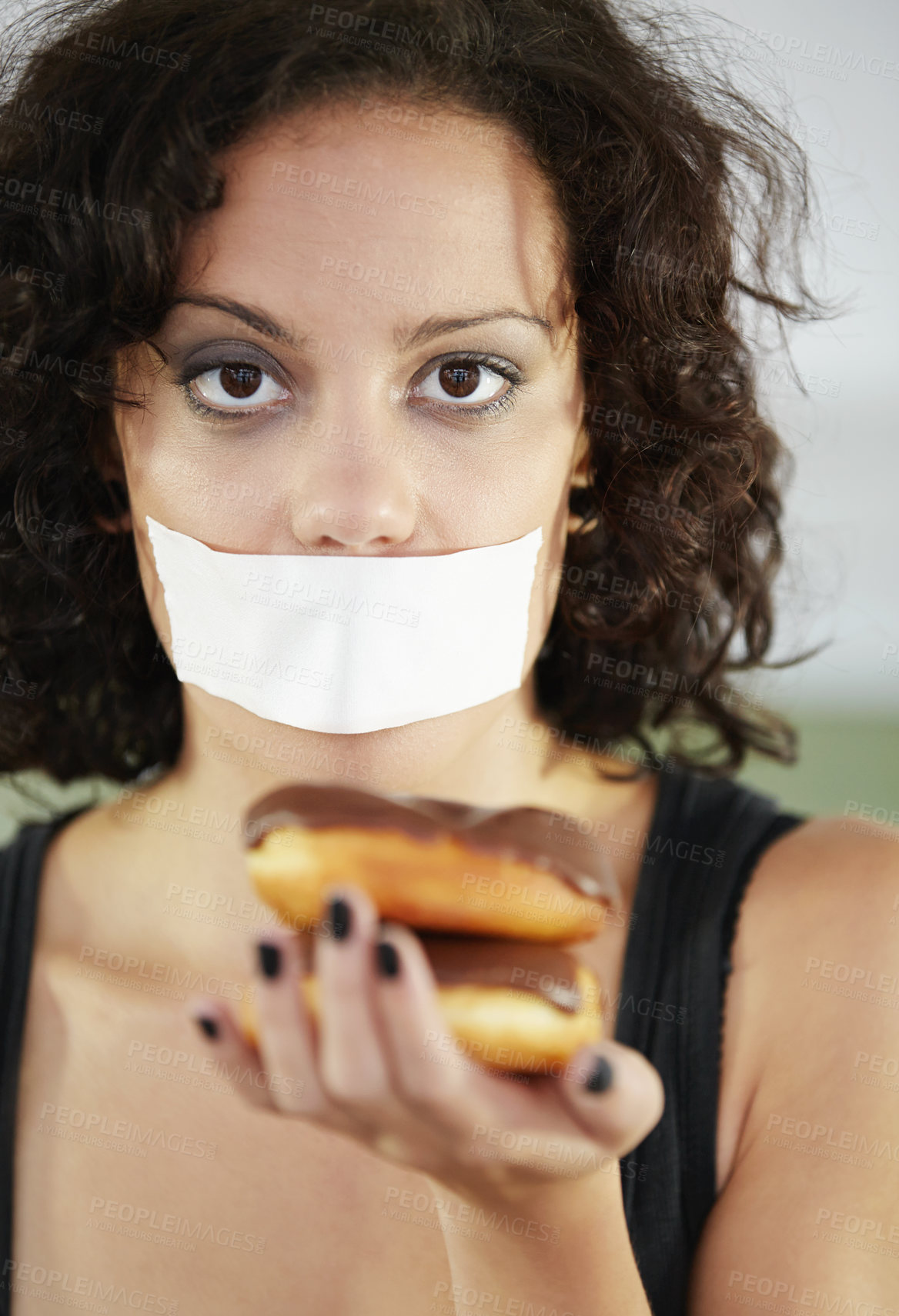 Buy stock photo Portrait, anorexia and woman with donut and tape over mouth to stop eating, unhappy and delusional. Face, covering and face of female suffering eating disorder, body dysmorphia or bulimia problem