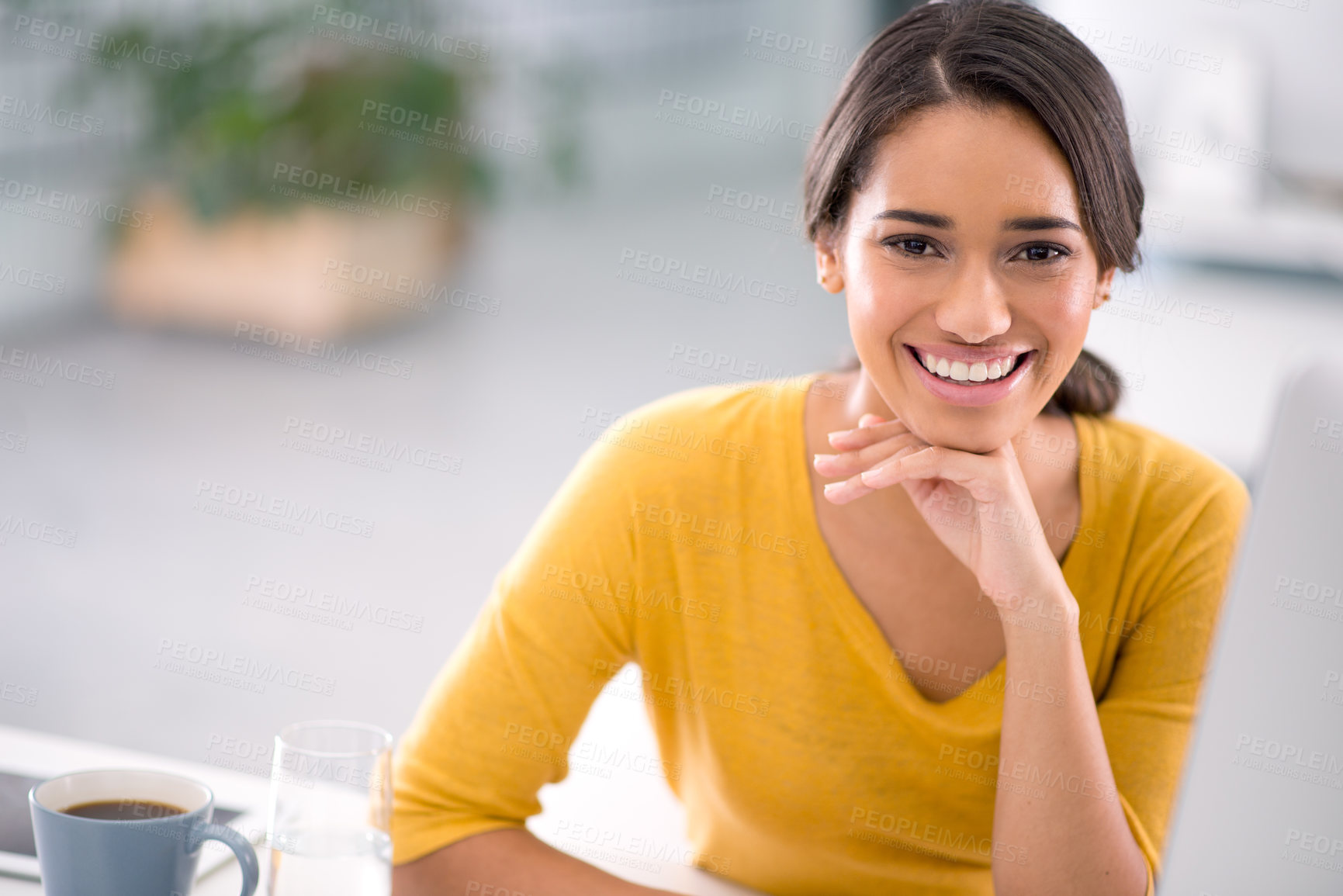 Buy stock photo Cropped shot of an attractive young businesswoman sitting at her desk