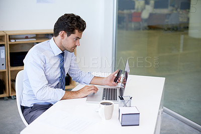 Buy stock photo Research, office and businessman with phone, laptop and coffee at startup with technology. Browse, online and business analyst at desk with computer, smartphone and internet connection for networking