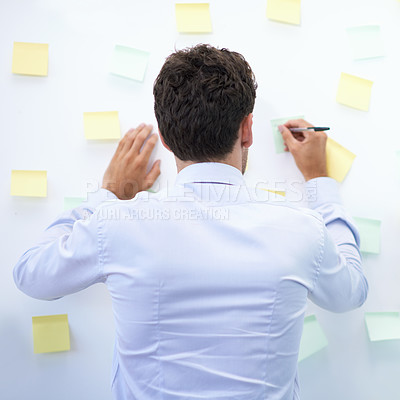 Buy stock photo Businessman, writing and sticky notes in office for planning, brainstorming and project with rear view. Entrepreneur, employee and ideas for agenda, schedule and proposal information at work