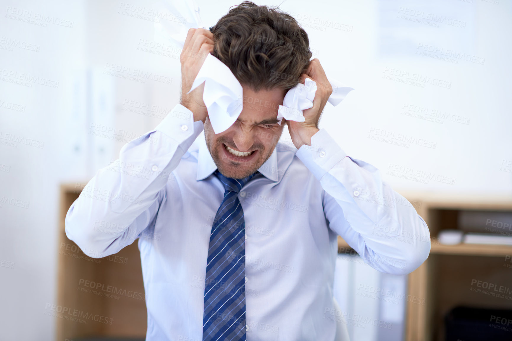 Buy stock photo Businessman, head and debt with crumpled paper, burnout and mistake for frustration, stressed and headache. Angry employee, worker and report for bills, worried and failure with audit or deadline