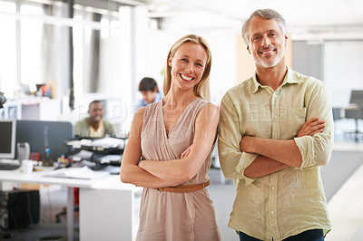 Buy stock photo Two experienced businesspeople standing together in the office