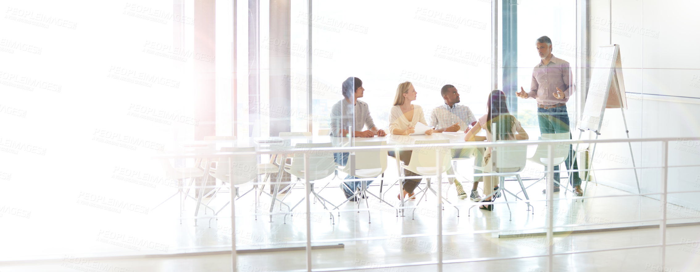 Buy stock photo Data review, colleagues and chart in a business meeting of their modern workstation with a lens flare. Teamwork or collaboration, planning or brainstorming and people working together in a boardroom