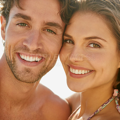 Buy stock photo Love, portrait and happy couple hug at a beach for travel, vacation and bonding in nature together. Ocean, adventure and face of people at the sea with care, trust and support, smile and fun outdoor