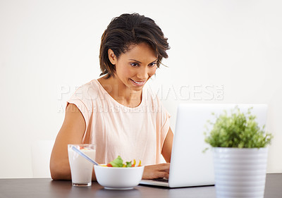 Buy stock photo Laptop, breakfast and remote work with a freelance woman in her home for health, diet or nutrition. Computer, startup or small business with a happy young entrepreneur eating a meal in the morning