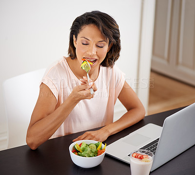 Buy stock photo Eating, salad and woman with laptop, remote work and healthy food or nutrition in home office. Hungry, person and working on lunch break with fruit and vegetables for energy or wellness in house
