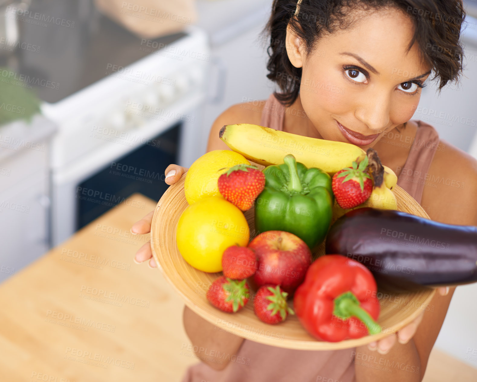 Buy stock photo Portrait, fruit and vegetables with a woman in the kitchen of her home for nutrition, diet or meal preparation. Face, health and recipe ingredients for cooking food with a person in her apartment