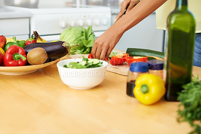Buy stock photo Hands, food and salad with a person in the kitchen of a home closeup for health, diet or nutrition. Cooking, bowl and ingredients for a vegetarian meal with an adult in an apartment for dinner