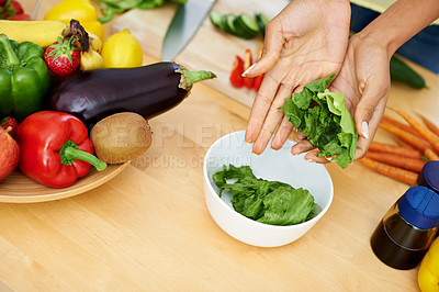 Buy stock photo Woman, hands and bowl of lettuce in kitchen for salad, diet or natural nutrition on wooden table at home. Closeup of female person or vegetarian preparing vegetables for vegan meal or healthy snack