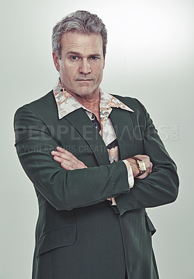Buy stock photo Cropped studio portrait of a mature man in a retro suit striking a confident pose