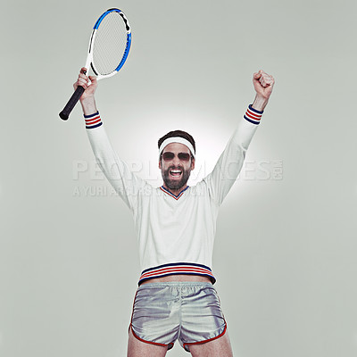 Buy stock photo Cropped shot of a young tennis player celebrating his victory