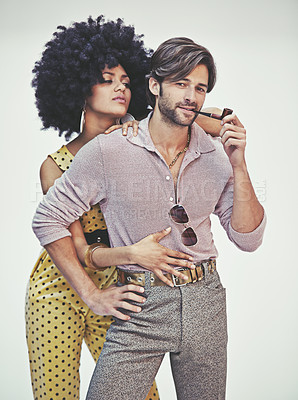 Buy stock photo Couple, portrait and fashion with pipe for smoking, style or outfit on a gray studio background. Young interracial man, woman or smoker in stylish pants, shirt or jumpsuit with jewelry or accessories