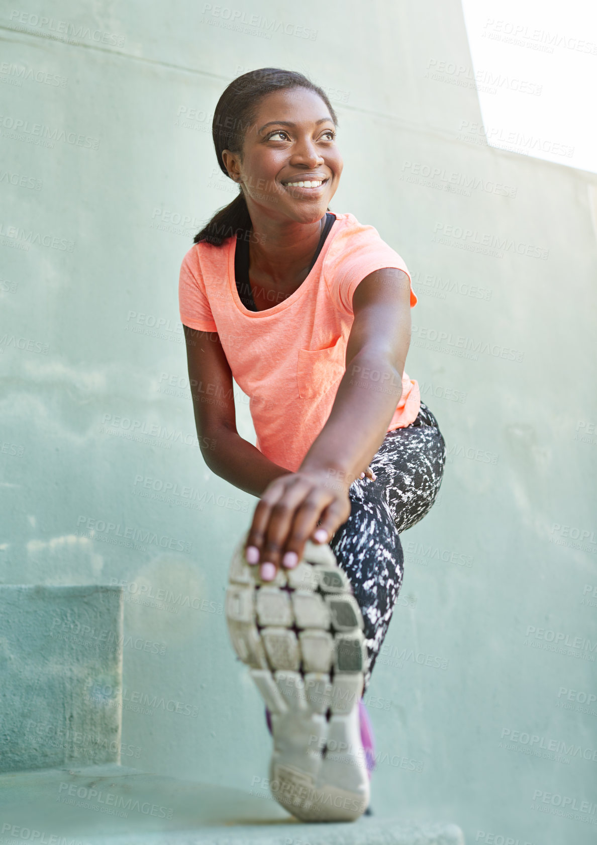 Buy stock photo Happy, black woman and runner with foot for stretching, fitness or outdoor workout preparation in city. Young African, female person or smile with warm up or getting ready for training or exercise