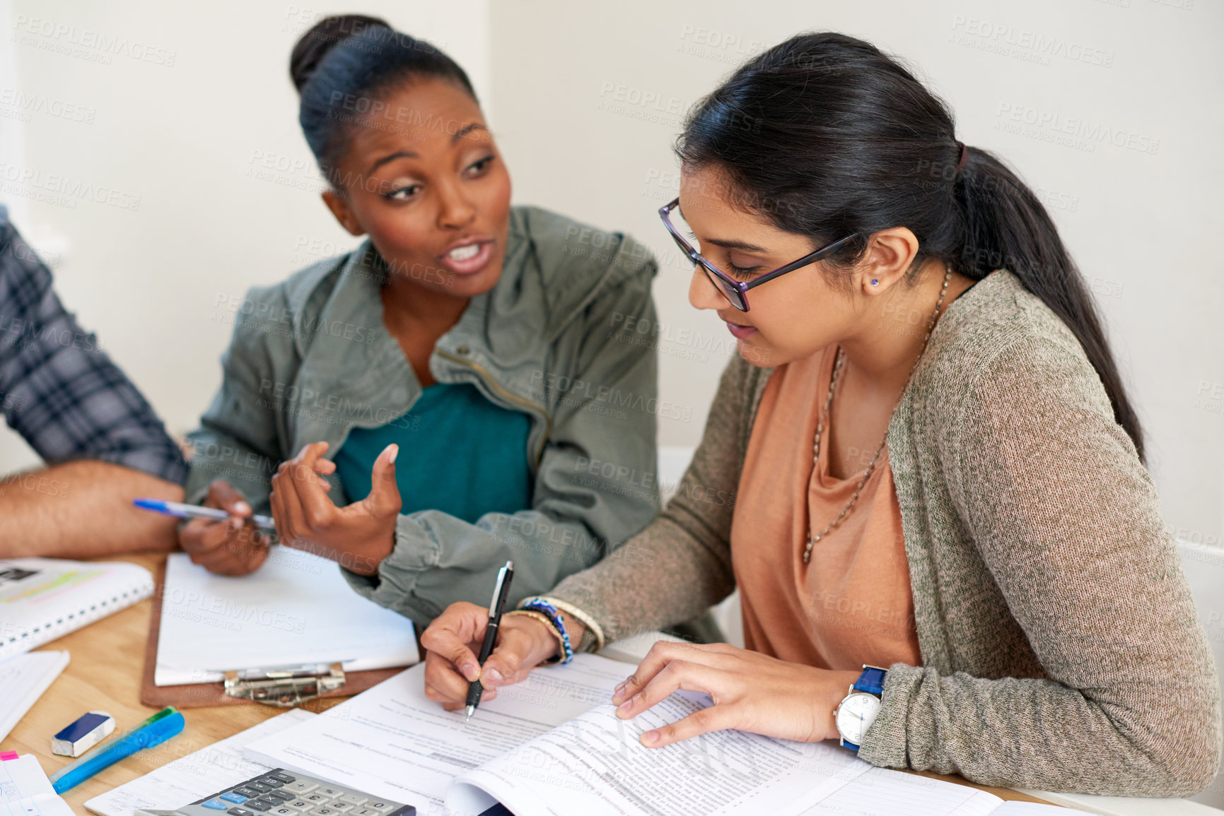 Buy stock photo Education, discussion and students in university for learning, studying or brainstorming at table. Study group, collaboration or idea with books for teamwork, exam preparation or diversity in college