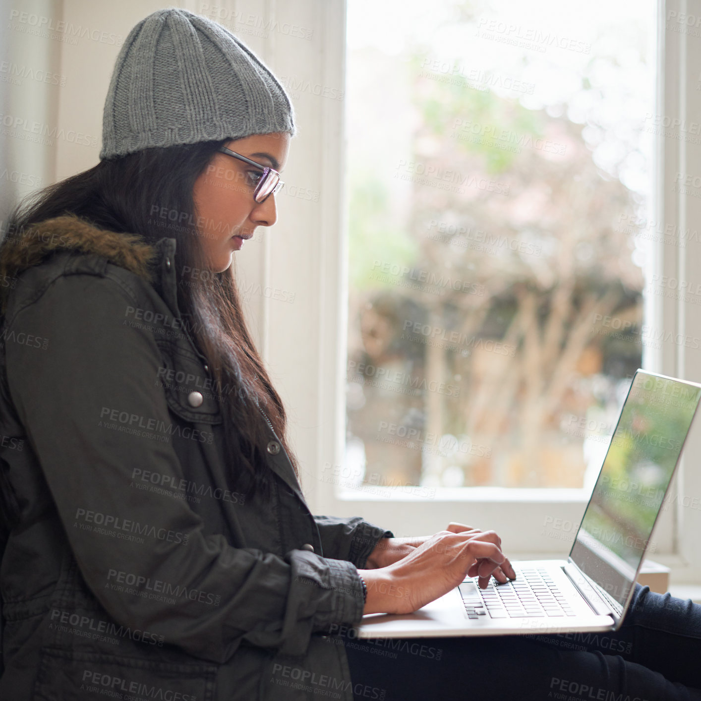 Buy stock photo Home, student or girl with laptop by window for research, literature essay and assignment project. Lady, connectivity and typing with computer for education, college proposal or online test in house