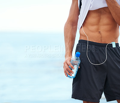 Buy stock photo Man, fitness and abs with water bottle in outdoor, mockup and space by inspiration for wellness. Male athlete, pride and confident for bodybuilding by ocean, sea and progress by exercise and workout 
