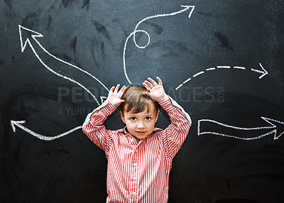 Buy stock photo Child, boy and portrait or smile by blackboard with drawing, arrows and creative fun in classroom at school. Kid, student and face for illustration, education and chalkboard with symbols at preschool