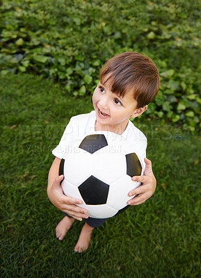 Buy stock photo Soccer, ball and excited child in garden for game, playing and fun on grass at home. Smile, happiness and boy with football, growth and development in backyard for sports for healthy children.