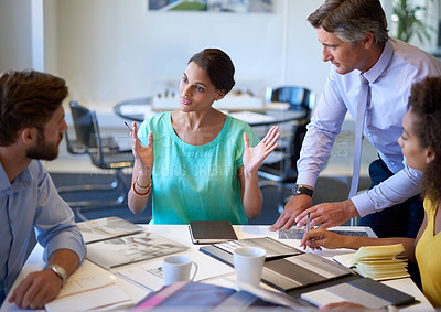 Buy stock photo Cropped shot of a group of businesspeople in a meeting