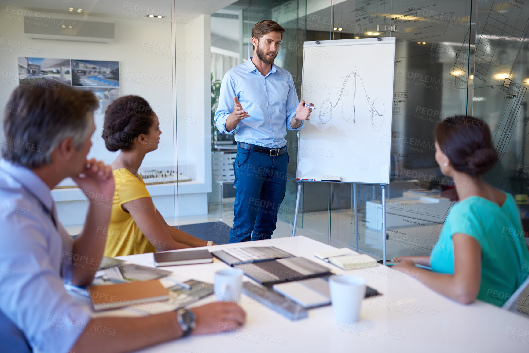 Buy stock photo Cropped shot of a handsome young man giving a business presentation