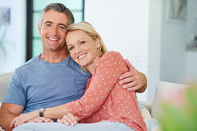 Buy stock photo Portrait of a loving mature couple relaxing on the sofa at home