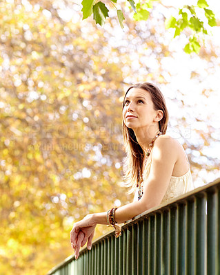 Buy stock photo Woman, thinking or park by fence in nature on holiday vacation in countryside, autumn or France, Garden, view or calm female person with peace outdoors for fresh air, wellness or break to relax 