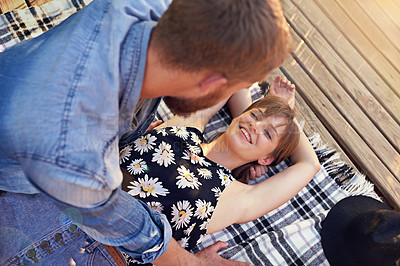 Buy stock photo Blanket, picnic and pier with couple outdoor together for date, love or romance in summer. Happy, moment or smile with man and woman having fun from above for anniversary, holiday or valentines day