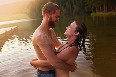 Buy stock photo Swimming, romance and happy couple hug at lake together on vacation, anniversary or holiday. Relationship, support and people in water for bonding, love or trust on honeymoon date for travel trip