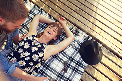 Buy stock photo Outdoor, couple and smile for picnic on break with love, rest and affection for care. Above, people and happy in relationship on blanket on valentines day for holiday to relax, chill and bonding