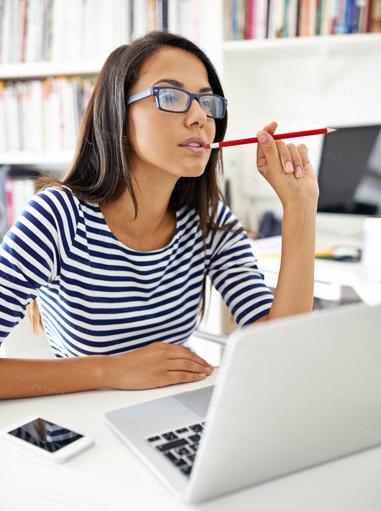 Buy stock photo Student, woman and laptop at library at college, thinking or stress with problem solving for education. Girl, person and computer at university for learning, research or bite pencil to study for exam